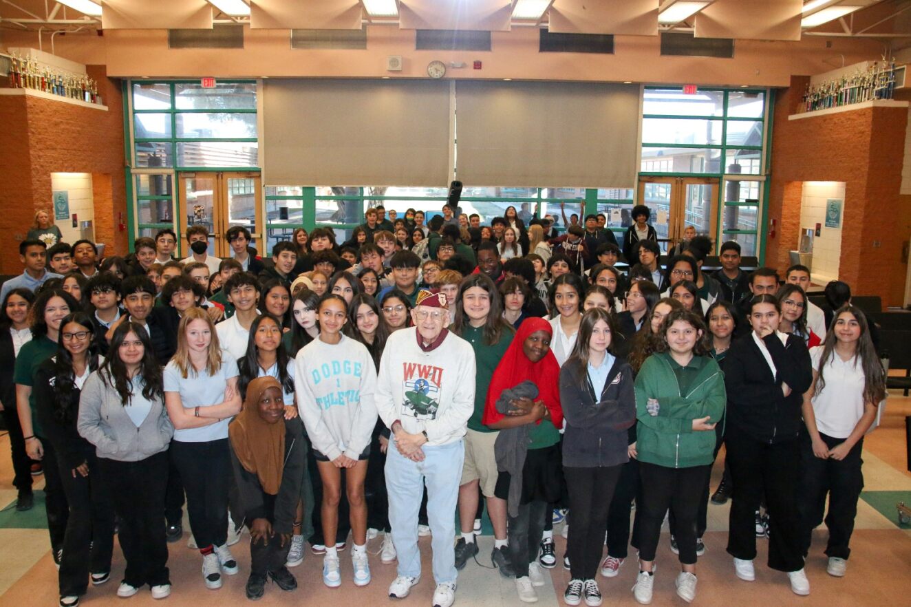 First Officer Harvey Horn smiles for a group photo with Dodge students