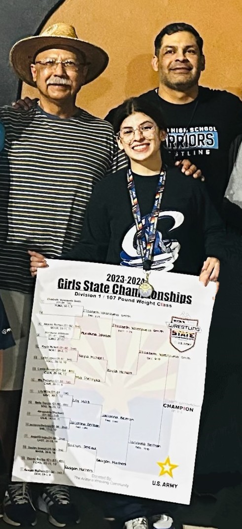 Elizabeth Valenzuela-Smith poses with her grandfather and father after winning state