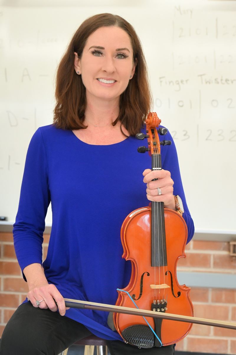 Ellen Ensey poses with a violin