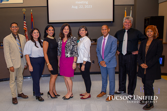 Board members pose with new appointees.