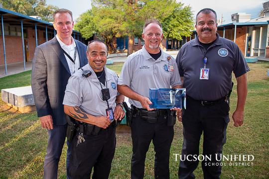 Sam Martin stand with his Safety team with Superintendent's Service Award.