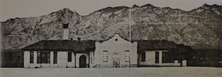 The original Davidson School with mountains in the background. 